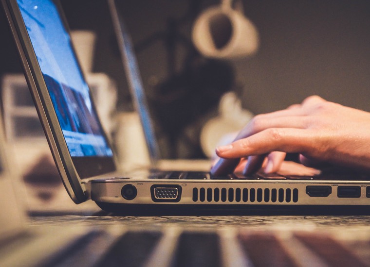 image of hands typing on a keyboard